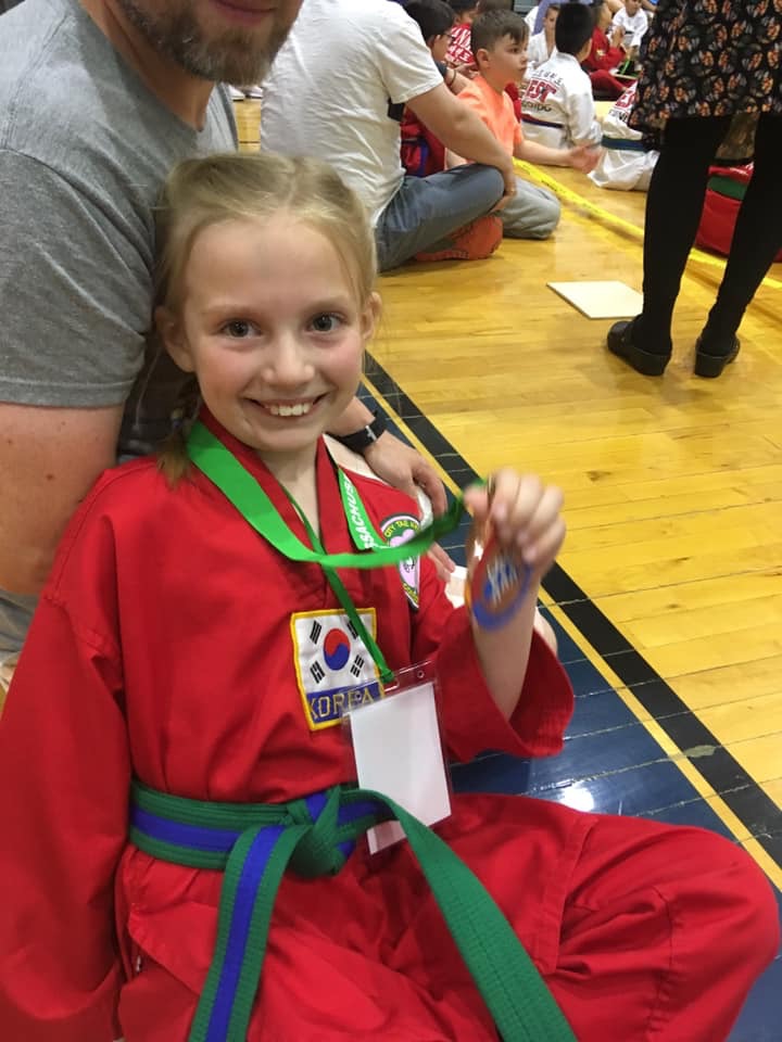 Sophia F. proudly showing her medal!